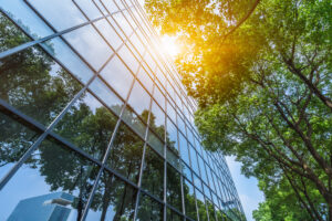 modern office building with green trees greenwashing