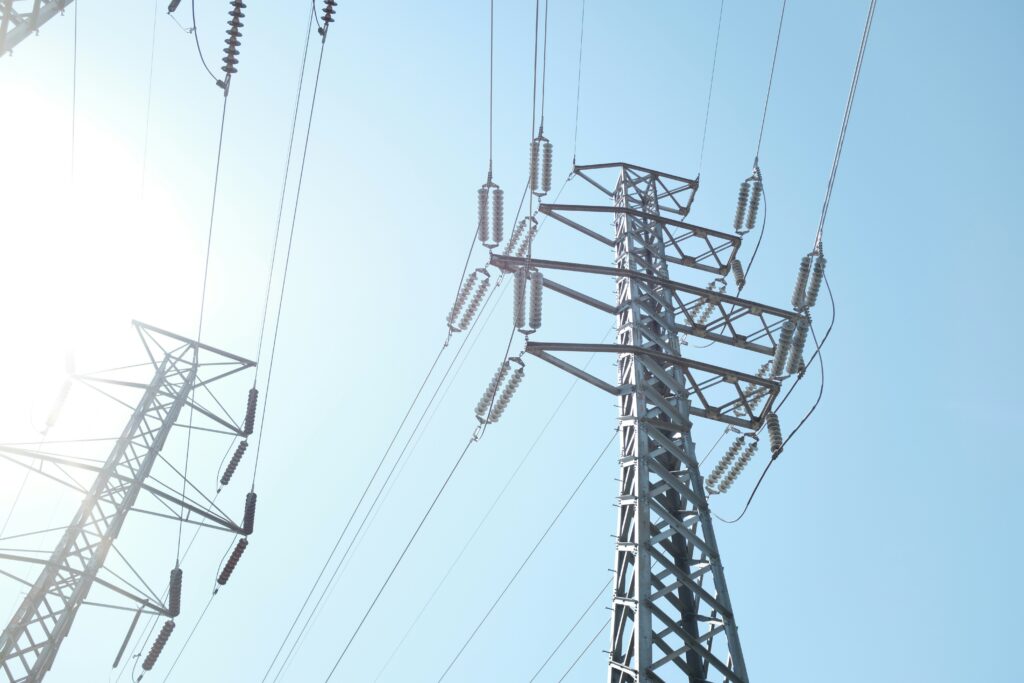 power lines from the ground up with blue sky, representing radio teleswitch service [rts]