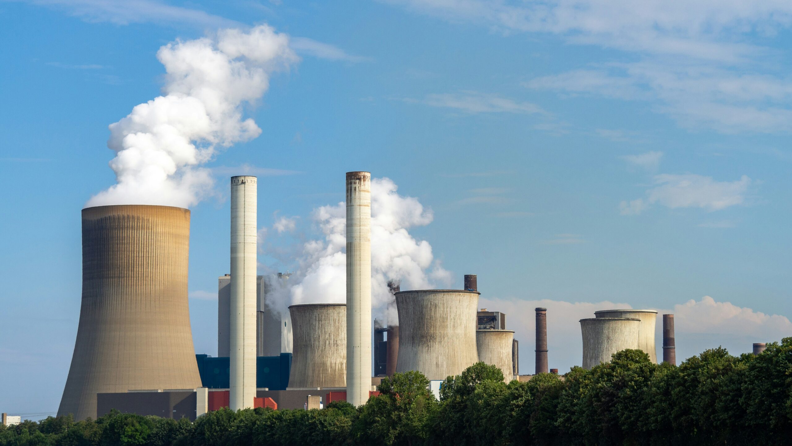 nuclear energy plants in distance with smoke